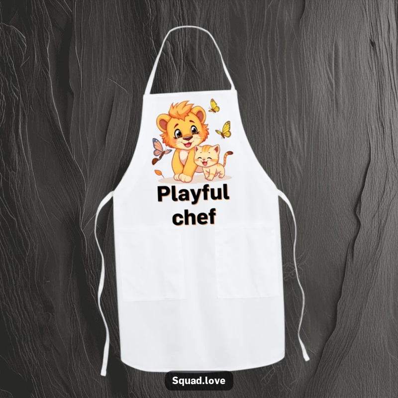 Funny apron depicting a lion cub playfully chasing a butterfly, with a grinning kitten close behind, perfect for a fun kitchen.