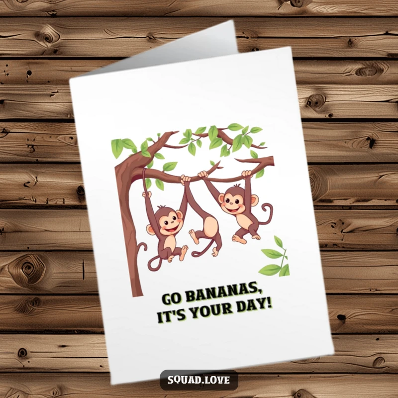 Funny Free Printable Birthday Card: Two playful monkeys swing from branches, reaching out to each other mid-air.