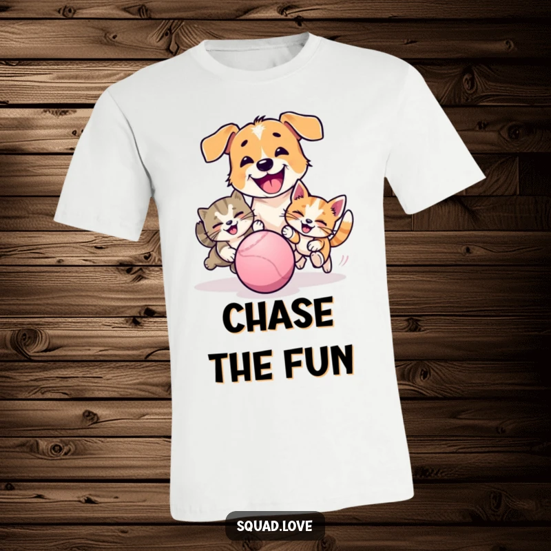 Funny t-shirt illustrating a happy dog and cat playfully chasing a bouncy ball, showcasing energetic and joyful pet interaction.