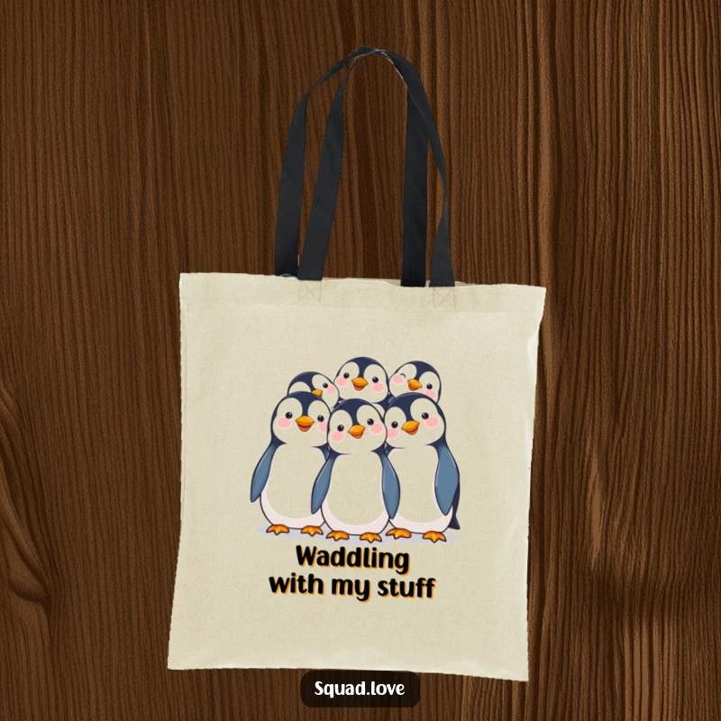 Funny tote bag showcasing smiling penguins happily huddling together, perfect for carrying essentials with adorable cheer.
